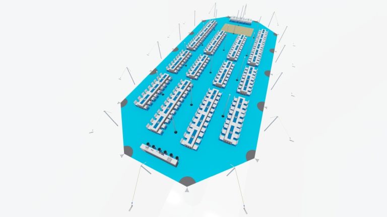 Vue d'ensemble de l'Arachnid « Extendable » de RHI, comprenant 2 modules d'extension, aménagée avec de longues tables de banquet rectangulaires et des allées de service