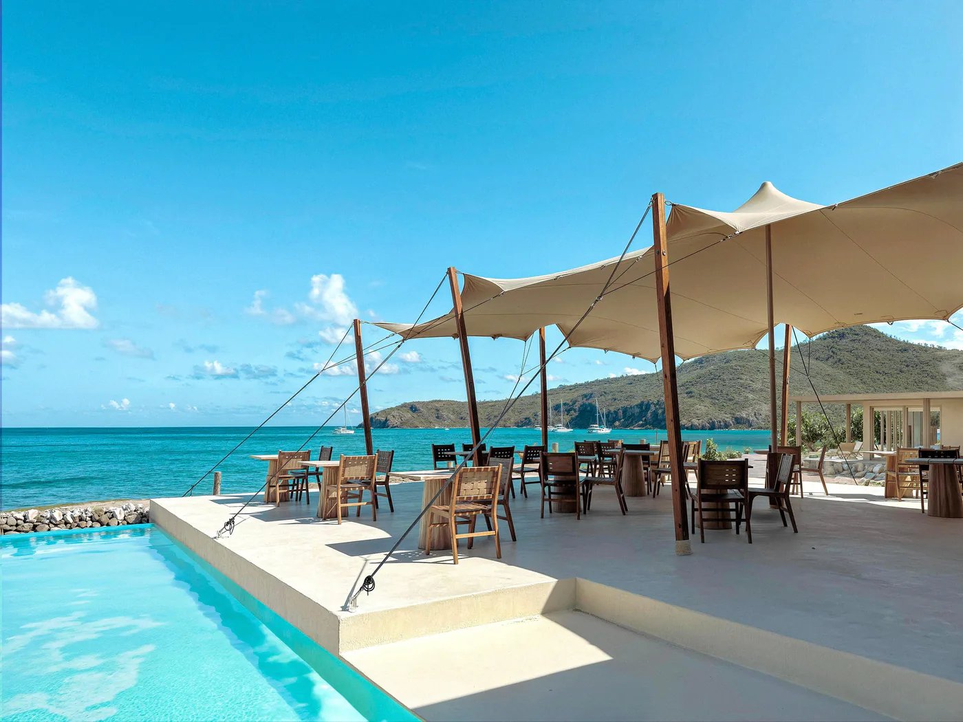 Bespoke stretch tent shading a poolside hospitality terrace