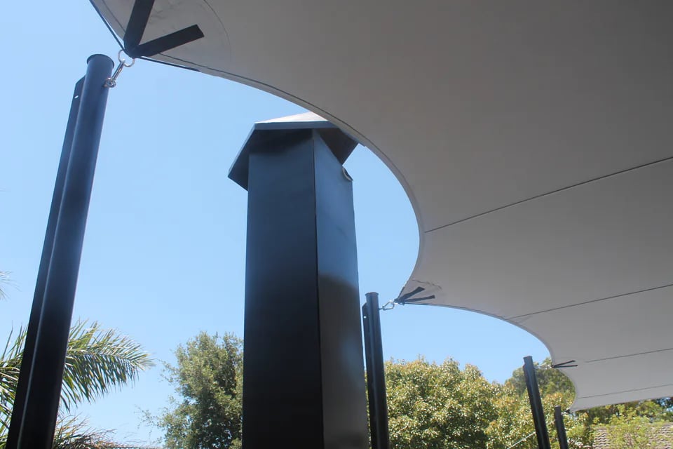 Custom stretch tent rigging and wall attachment detail