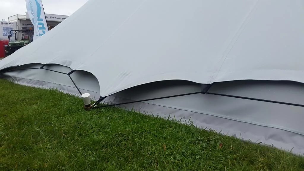 RHI side skirts sealing scalloped gaps along a stretch tent perimeter