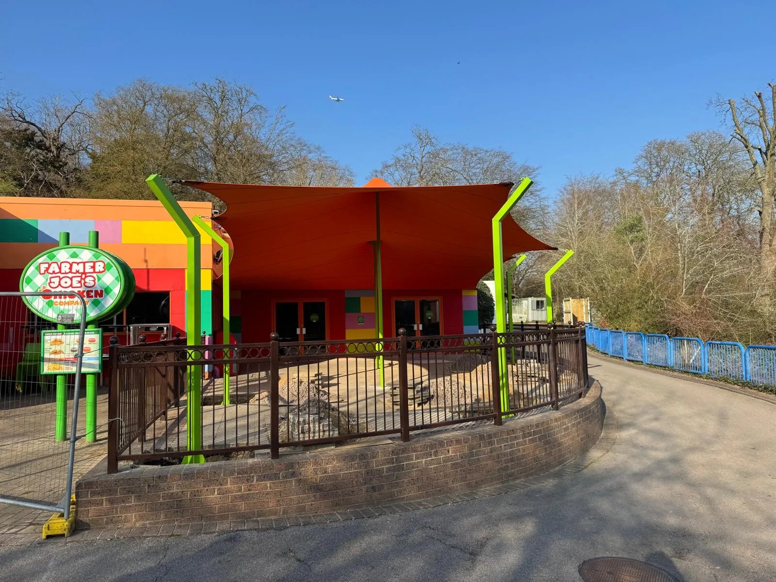 Completed bespoke orange stretch tent at an outdoor venue