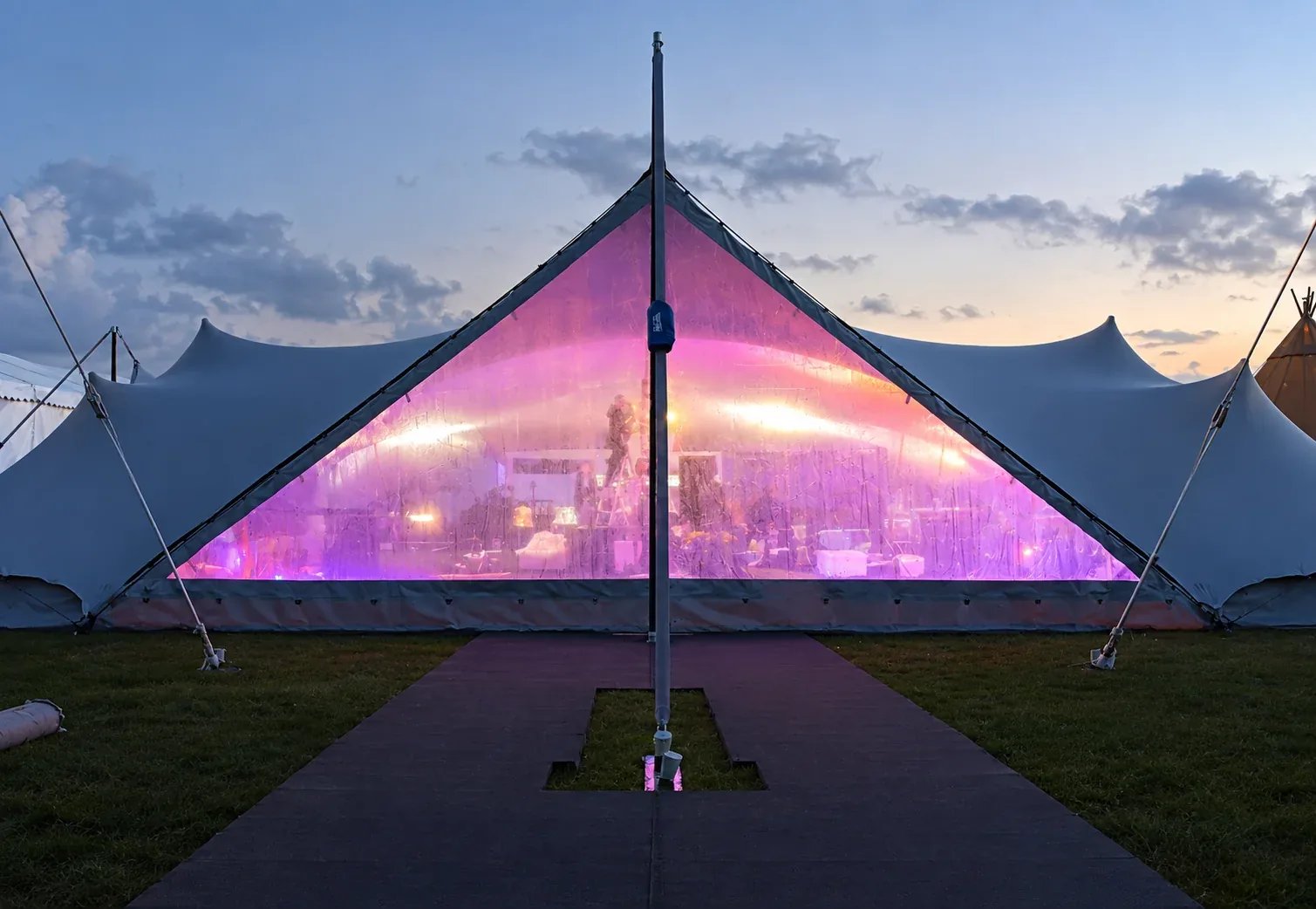 Clear stretch tent doorway illuminated in the evening