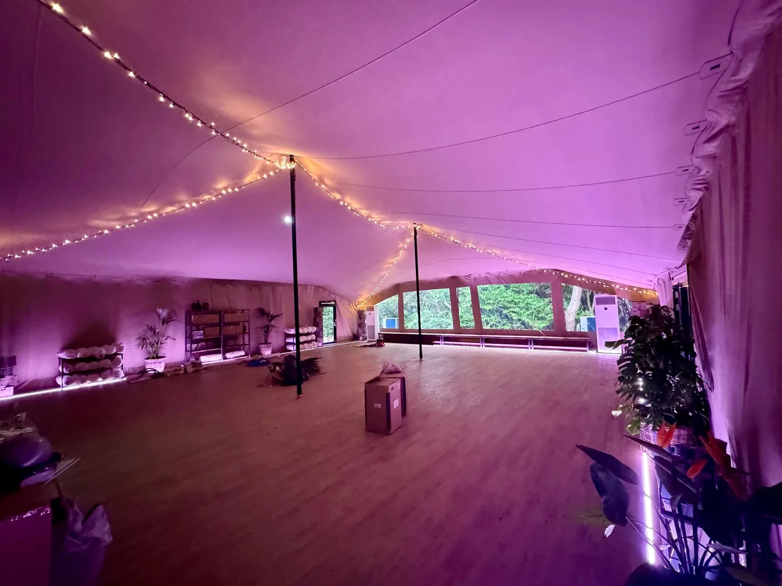 Enclosed stretch tent interior illuminated with purple lighting