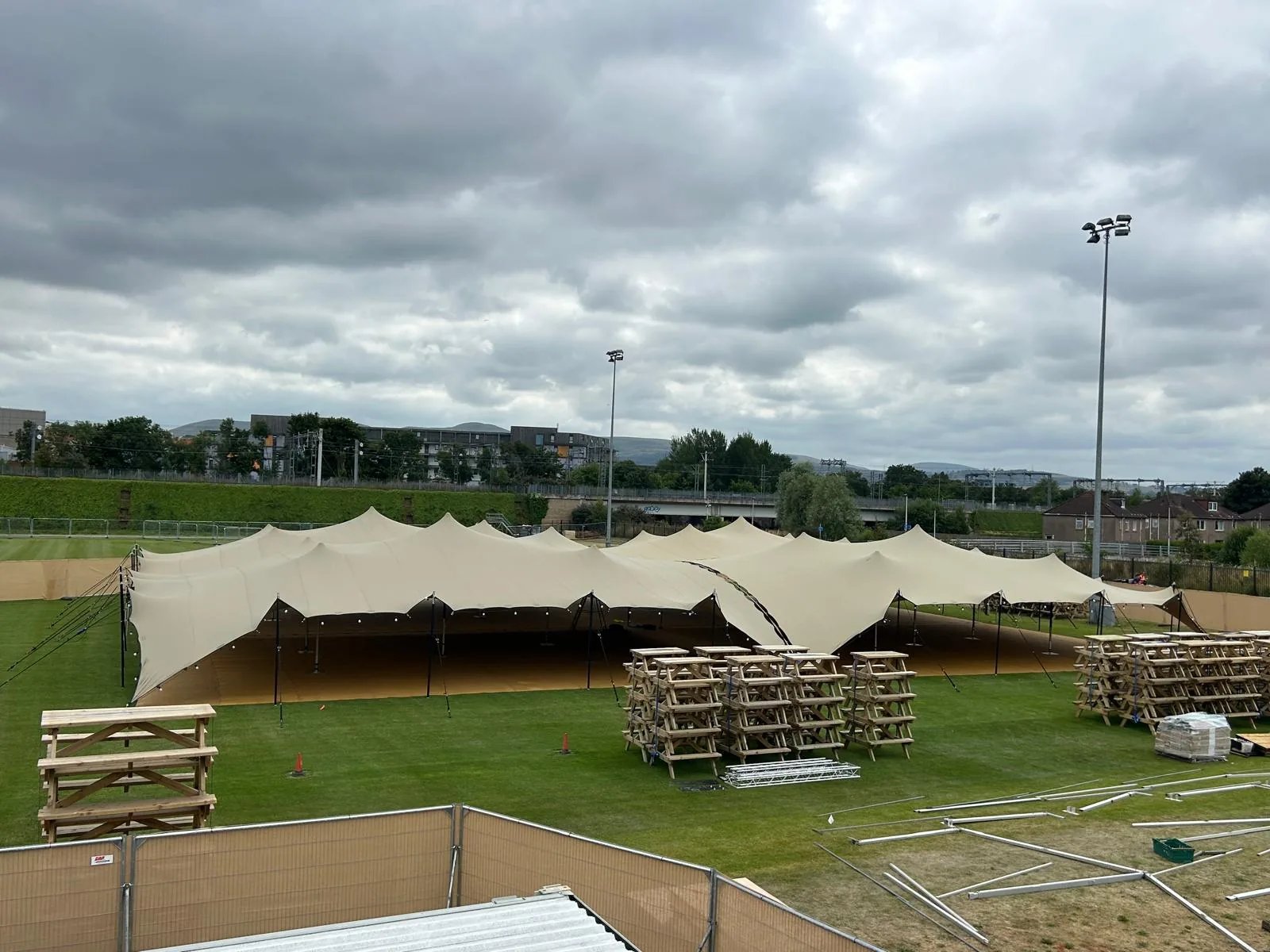 Four linked RHI stretch tents covering outdoor seating