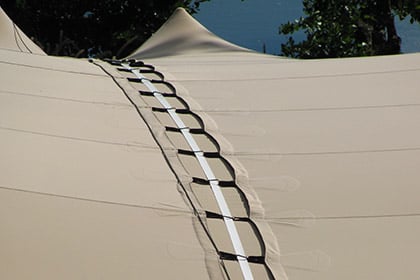 Close-up of a gutter connection joining two RHI stretch tents