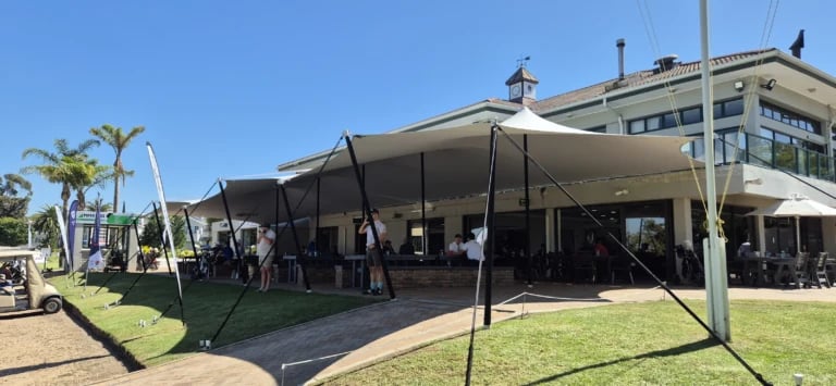 stretch tent over clubhouse terrace seating beside a golf course — Durbanville Golf Course Clubhouse Stretch Tent